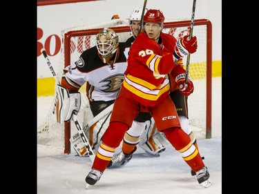 Alex Chiasson of the Calgary Flames skates in front of Shea Theodore of the Anaheim Ducks and goalie Jonathan Bernier during NHL action in Calgary, Alta., on Sunday, April 2, 2017. The Ducks won 4-3. Lyle Aspinall/Postmedia Network