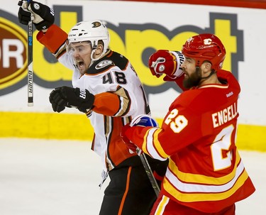 Logan Shaw of the Anaheim Ducks celebrates scoring what would be the game-winner near Deryk Engelland of the Calgary Flames during NHL action in Calgary, Alta., on Sunday, April 2, 2017. Lyle Aspinall/Postmedia Network