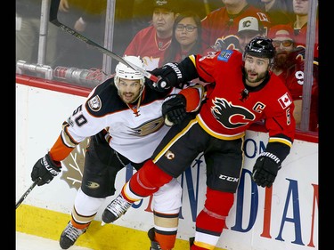 Ducks Antoine Vermette (L) battles Flames Mark Giordano during NHL playoff game 4 action between the Calgary Flames and Anaheim Ducks in Calgary, Alta on Wednesday April 19, 2017.