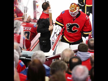 Calgary Flames goalie Brian Elliott (L) leaves the ice after giving up a goal to the Anaheim Ducks during the 2017 Stanley Cup playoffs in Calgary, Alta., on Wednesday, April 19, 2017. AL CHAREST/POSTMEDIA