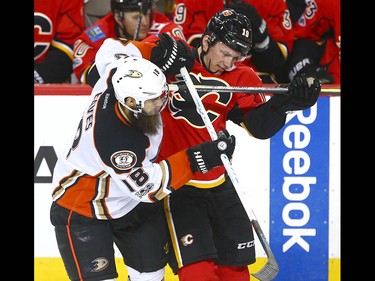Ducks Patrick Eaves (L) battles Flames Matthew Tkachuk during NHL playoff game 4 action between the Calgary Flames and Anaheim Ducks in Calgary, Alta on Wednesday April 19, 2017. Jim Wells/Postmedia