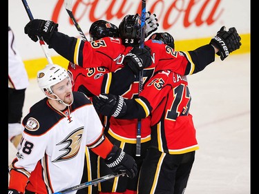 Calgary Flames Sean Monahan celebrates with teammates after scoring against the Anaheim Ducks during the 2017 Stanley Cup playoffs in Calgary, Alta., on Wednesday, April 19, 2017. AL CHAREST/POSTMEDIA