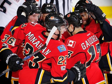 Calgary Flames Sean Monahan celebrates with teammates after scoring against the Anaheim Ducks during the 2017 Stanley Cup playoffs in Calgary, Alta., on Wednesday, April 19, 2017. AL CHAREST/POSTMEDIA