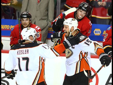 Ducks Ryan Kesler (L) and Ryan Getzlaf celebrate Getzlaf's empty net goal during NHL playoff game 4 action between the Calgary Flames and Anaheim Ducks in Calgary, Alta on Wednesday April 19, 2017. The Ducks win the series 4-0. Jim Wells/Postmedia