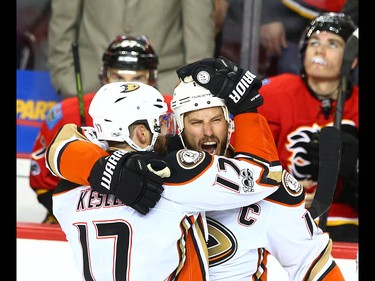 Ducks Ryan Kesler (L) and Ryan Getzlaf celebrate Getzlaf's empty net goal during NHL playoff game 4 action between the Calgary Flames and Anaheim Ducks in Calgary, Alta on Wednesday April 19, 2017. The Ducks win the series 4-0. Jim Wells/Postmedia