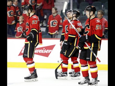 Calgary Flames Dougie Hamilton, left, and teammates react to their loss against the Anaheim Ducks in NHL playoff hockey action at the Scotiabank Saddledome in Calgary, Alta. on Wednesday April 19, 2017. Leah Hennel/Postmedia