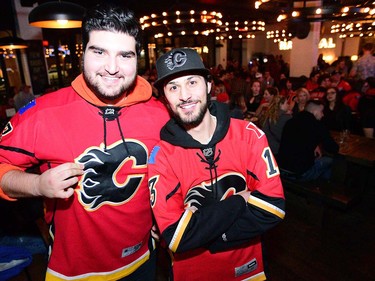 Hooman Hodaie and Sama Banaei cheer on the Flames at National. Calgary Flames fans were out in the bars on 17th Avenue in Calgary, Alta., on April 13, 2017. Flames are taking on the Anaheim Ducks in the first round of the NHL Playoffs. Ryan McLeod/Postmedia Network