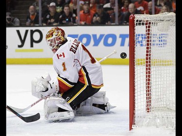 The puck hit by Anaheim Ducks' Jakob Silfverberg, of Sweden, enters the net past Calgary Flames goalie Brian Elliott for a goal during the second period in Game 1 of a first-round NHL hockey Stanley Cup playoff series Thursday, April 13, 2017, in Anaheim, Calif. (AP Photo/Jae C. Hong) ORG XMIT: CAJH115