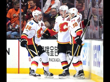 ANAHEIM, CA - APRIL 13:  Sean Monahan #23 celebrates his goal with Troy Brouwer #36 and Kris Versteeg #10 to take a 1-0 lead over the Anaheim Ducks during the first period in Game One of the Western Conference First Round during the 2017 NHL Stanley Cup Playoffs at Honda Center on April 13, 2017 in Anaheim, California.  (Photo by Harry How/Getty Images)