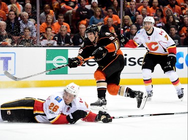 ANAHEIM, CA - APRIL 13:  Jakob Silfverberg #33 of the Anaheim Ducks shoots over a sliding Michael Stone #26 of the Calgary Flames during a 3-2 Ducks win in Game One of the Western Conference First Round during the 2017 NHL Stanley Cup Playoffs at Honda Center on April 13, 2017 in Anaheim, California.  (Photo by Harry How/Getty Images)