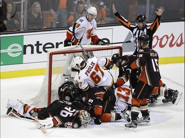 Anaheim Ducks players are tangled up with Calgary Flames players during the third period in Game 1 of a first-round NHL hockey Stanley Cup playoff series Thursday, April 13, 2017, in Anaheim, Calif. The Ducks won 3-2. (AP Photo/Jae C. Hong) ORG XMIT: CAJH121