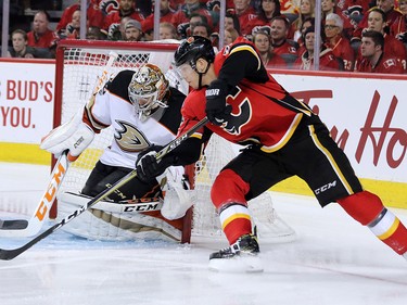 The Calgary Flames Alex Chiasson looks wraps around the net in a scoring chance on Anaheim Ducks goaltender John Gibson during game 3 of their Stanley Cup playoff series at the Scotiabank Saddledome on Monday April 17, 2017. Gavin Young/Postmedia Network