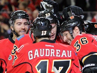 The Calgary Flames congratulate Sean Monahan after he scored on Anaheim Ducks goaltender John Gibson during game 3 of their Stanley Cup playoff series at the Scotiabank Saddledome on Monday April 17, 2017. Gavin Young/Postmedia Network