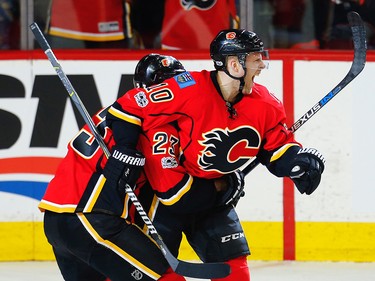 Calgary Flames Kris Versteeg celebrates with teammate Sean Monahan after scoring against the Anaheim Ducks during the 2017 Stanley Cup playoffs in Calgary, Alta., on Monday, April 17, 2017. AL CHAREST/POSTMEDIA