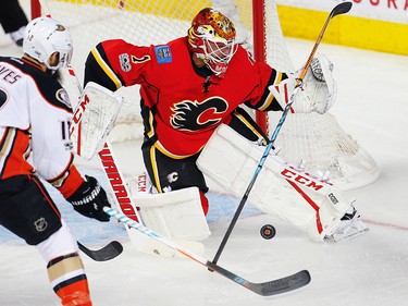 Calgary Flames Brian Elliott makes a save on a shot by Patrick Eaves  of the Anaheim Ducks during 2017 Stanley Cup playoffs in Calgary, Alta., on Monday, April 17, 2017. AL CHAREST/POSTMEDIA