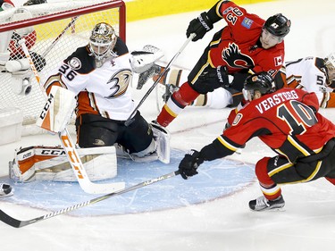Calgary Flames Kris Versteeg, right, tries to score on Anaheim Ducks goalie John Gibson during NHL playoff action at the Scotiabank Saddledome in Calgary, Alta. on Monday April 17, 2017. Leah Hennel/Postmedia