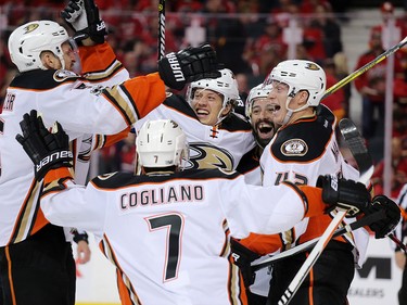 The Anaheim Ducks celebrate winning over time 5-4 to take game 3 against the Calgary Flames during their Stanley Cup playoff series at the Scotiabank Saddledome on Monday April 17, 2017. Gavin Young/Postmedia Network