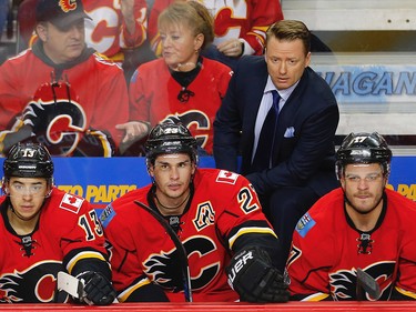 Calgary Flames Johnny Gaudreau, Sean Monahan and Lance Boumaon the bench during a 5-4 OT loss to the Anaheim Ducks in 2017 Stanley Cup playoffs in Calgary, Alta., on Monday, April 17, 2017. AL CHAREST/POSTMEDIA
