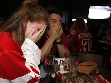 Calgary Flames fans reacts as the Ducks scored scored in OT to beat the Calgary Flames in game 3 at Trolley 5 Restaurant and Brewery on the Red Mile on Monday April 17, 2017. DARREN MAKOWICHUK/Postmedia Network