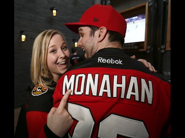 Calgary Flames fans L-R, Kim Bobinec and Brett Clark get ready to cheer on their team at Trolley 5 on the Red Mile on Saturday April 15, 2017. DARREN MAKOWICHUK/Postmedia Network