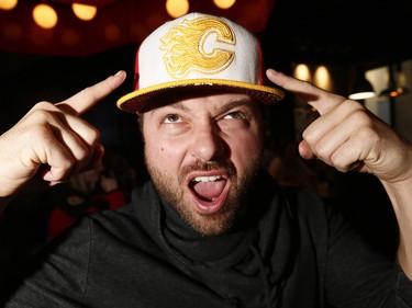 Calgary Flames fan Chad Welechenko gets ready to cheer on his team at Trolley 5 on the Red Mile on Saturday April 15, 2017. DARREN MAKOWICHUK/Postmedia Network