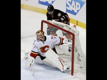 Calgary Flames goalie Brian Elliott fails to block a goal by Anaheim Ducks center Rickard Rakell during the first period in Game 2 of a first-round NHL hockey Stanley Cup playoff series in Anaheim, Calif., Saturday, April 15, 2017. (AP Photo/Chris Carlson) ORG XMIT: ANA101