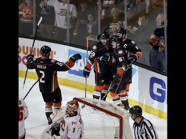Anaheim Ducks celebrate center Rickard Rakell's goal against the Calgary Flames during the first period in Game 2 of a first-round NHL hockey Stanley Cup playoff series in Anaheim, Calif., Saturday, April 15, 2017. (AP Photo/Chris Carlson) ORG XMIT: ANA104