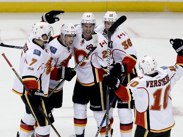 Calgary Flames celebrates after a goal by center Sean Monahan (23) against the Anaheim Ducks during the second period in Game 2 of a first-round NHL hockey Stanley Cup playoff series in Anaheim, Calif., Saturday, April 15, 2017. (AP Photo/Chris Carlson) ORG XMIT: ANA109
