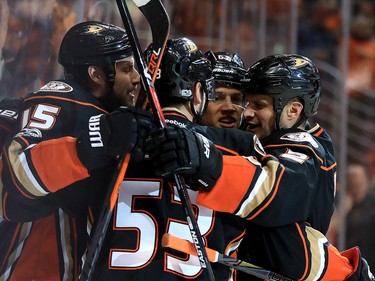 ANAHEIM, CA - APRIL 15:  Kevin Bieksa #2, Ryan Getzlaf #15 and Shea Theodore #53 of the Anaheim Ducks celebrate a goal during the first period of Game Two of the Western Conference First Round against the Calgary Flames during the 2017 NHL Stanley Cup Playoffs at Honda Center on April 15, 2017 in Anaheim, California.  (Photo by Sean M. Haffey/Getty Images)