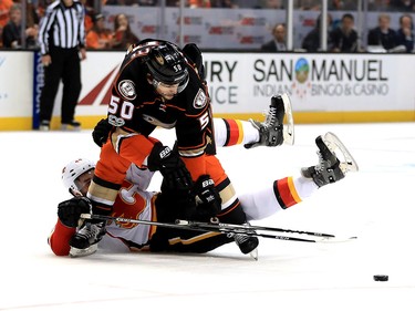 ANAHEIM, CA - APRIL 15:  Matt Bartkowski #44 of the Calgary Flames battles Antoine Vermette #50 of the Anaheim Ducks for a loose puck  during the first period of Game Two of the Western Conference First Round during the 2017 NHL Stanley Cup Playoffs at Honda Center on April 15, 2017 in Anaheim, California.  (Photo by Sean M. Haffey/Getty Images)
