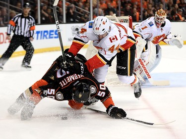 ANAHEIM, CA - APRIL 15:  Matt Bartkowski #44 of the Calgary Flames pushes Antoine Vermette #50 of the Anaheim Ducks to the ice during the first period of Game Two of the Western Conference First Round during the 2017 NHL Stanley Cup Playoffs at Honda Center on April 15, 2017 in Anaheim, California.  (Photo by Sean M. Haffey/Getty Images)