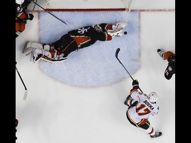 Anaheim Ducks goalie John Gibson blocks a shot by Calgary Flames left wing Lance Bouma during the second period in Game 2 of a first-round NHL hockey Stanley Cup playoff series in Anaheim, Calif., Saturday, April 15, 2017. (AP Photo/Chris Carlson) ORG XMIT: ANA110