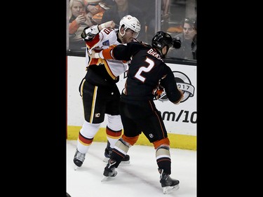 Calgary Flames left wing Micheal Ferland fights with Anaheim Ducks defenseman Kevin Bieksa during the second period in Game 2 of a first-round NHL hockey Stanley Cup playoff series in Anaheim, Calif., Saturday, April 15, 2017. (AP Photo/Chris Carlson) ORG XMIT: ANA112