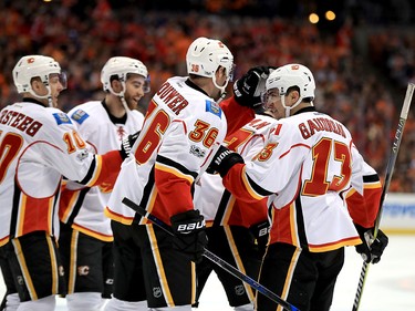 ANAHEIM, CA - APRIL 15:  Johnny Gaudreau #13 Troy Brouwer #36  ,Kris Versteeg #10 and Sean Monahan #23 of the Calgary Flames celebrate a goal during the second period of Game Two of the Western Conference First Round against the Anaheim Ducks  during the 2017 NHL Stanley Cup Playoffs at Honda Center on April 15, 2017 in Anaheim, California.  (Photo by Sean M. Haffey/Getty Images)