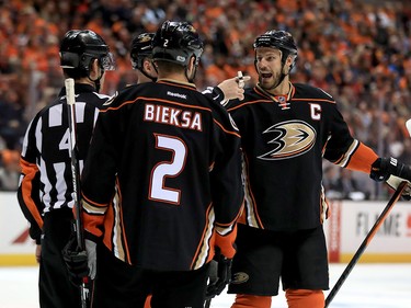 ANAHEIM, CA - APRIL 15:  Ryan Getzlaf #15 and Kevin Bieksa #2 of the Anaheim Ducks talk with referee Wes McCauley during the second period of Game Two of the Western Conference First Round against the Calgary Flames  during the 2017 NHL Stanley Cup Playoffs at Honda Center on April 15, 2017 in Anaheim, California.  (Photo by Sean M. Haffey/Getty Images)