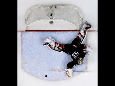 Anaheim Ducks goalie John Gibson blocks a Calgary Flames shot during the second period in Game 2 of a first-round NHL hockey Stanley Cup playoff series in Anaheim, Calif., Saturday, April 15, 2017. (AP Photo/Chris Carlson) ORG XMIT: ANA111