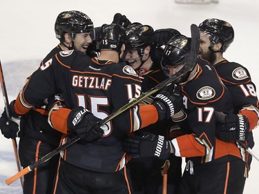 Members of the Anaheim Ducks celebrates after center Ryan Getzlaf's (15) tie-breaking goal against the Calgary Flames during the third period in Game 2 of a first-round NHL hockey Stanley Cup playoff series in Anaheim, Calif., Saturday, April 15, 2017. The Ducks won 3-2. (AP Photo/Chris Carlson) ORG XMIT: ANA119