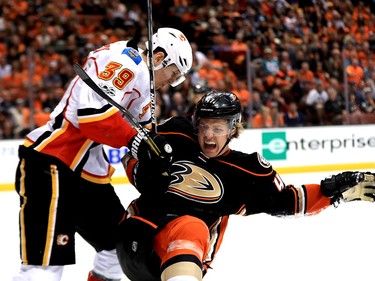 ANAHEIM, CA - APRIL 15:  Hampus Lindholm #47 of the Anaheim Ducks is hit by Alex Chiasson #39 of the Calgary Flames during the second period of Game Two of the Western Conference First Round during the 2017 NHL Stanley Cup Playoffs at Honda Center on April 15, 2017 in Anaheim, California.  (Photo by Sean M. Haffey/Getty Images)