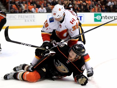 ANAHEIM, CA - APRIL 15:  Hampus Lindholm #47 of the Anaheim Ducks is hit by Alex Chiasson #39 of the Calgary Flames during the second period of Game Two of the Western Conference First Round during the 2017 NHL Stanley Cup Playoffs at Honda Center on April 15, 2017 in Anaheim, California.  (Photo by Sean M. Haffey/Getty Images)
