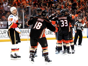 ANAHEIM, CA - APRIL 15:  Ryan Getzlaf #15 is congratuated by Jakob Silfverberg #33 and Patrick Eaves #18 of the Anaheim Ducks as Matt Stajan #18 of the Calgary Flames skates past after scoring a goal during the third period of Game Two of the Western Conference First Round during the 2017 NHL Stanley Cup Playoffs at Honda Center on April 15, 2017 in Anaheim, California.  (Photo by Sean M. Haffey/Getty Images)