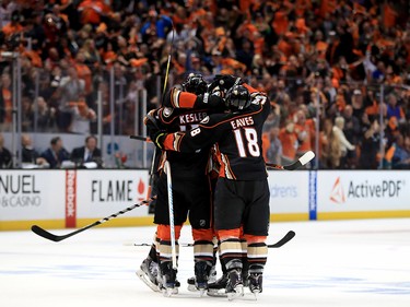 ANAHEIM, CA - APRIL 15:  Ryan Getzlaf #15 is congratulated by Patrick Eaves #18 and Ryan Kesler #17 of the Anaheim Ducks during the third period of Game Two of the Western Conference First Round against the Calgary Flames  during the 2017 NHL Stanley Cup Playoffs at Honda Center on April 15, 2017 in Anaheim, California.  (Photo by Sean M. Haffey/Getty Images)