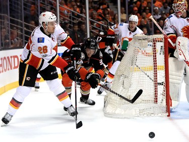 ANAHEIM, CA - APRIL 15:  Jakob Silfverberg #33 of the Anaheim Ducks defends as Michael Stone #26 of the Calgary Flames passes the puck during the third period of Game Two of the Western Conference First Round during the 2017 NHL Stanley Cup Playoffs at Honda Center on April 15, 2017 in Anaheim, California.  (Photo by Sean M. Haffey/Getty Images)