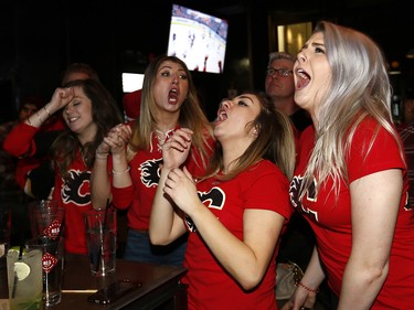 Calgary Flames fans reacts as the Ducks scored the go ahead goal to make it 3-2 against the Calgary Flames at Trolley 5 Restaurant and Brewery on the Red Mile on Saturday April 15, 2017. DARREN MAKOWICHUK/Postmedia Network