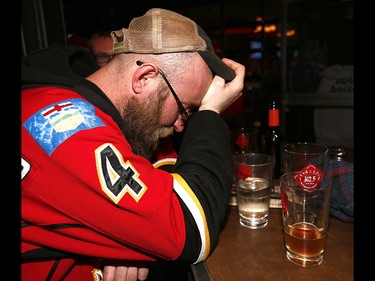 Calgary Flames fans react as the Ducks scored the go ahead goal to make it 3-2 against the Calgary Flames in the third period at Trolley 5 Restaurant and Brewery on the Red Mile on Saturday April 15, 2017. DARREN MAKOWICHUK/Postmedia Network