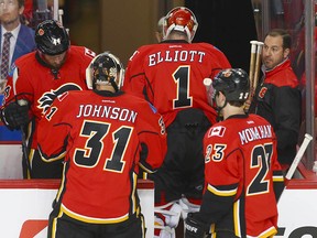 Flames goalie Brian Elliott leaves the game and is replaced by Chad Johnson after giving up a goal in the first period.