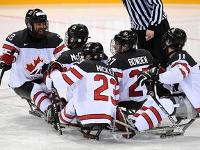Canada's para hockey team celebrates a goal on their way to defeating the United States 4-1 Thursday, April 20, 2017 to capture a gold medal at the world para hockey championship in Gangenung, South Korea.