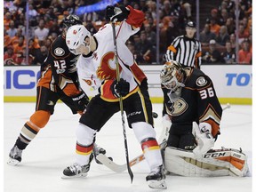 Anaheim Ducks goalie John Gibson makes a save on Calgary Flames' Alex Chiasson in Game 1 of their first-round playoff series Thursday, April 13, 2017, in Anaheim, Calif. (The Canadian Press)