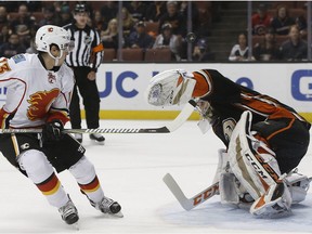 Anaheim Ducks goalie John Gibson deflects a breakaway shot by Calgary Flames left wing Johnny Gaudreau in Anaheim, Calif., on April 4, 2017. (AP Photo)