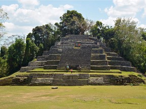 Lamanai's jaguar temple was built in the 6th century AD and modified several times up to at least the 15th century. The stone patterning on the lowest-level turns depicts two jaguar faces that date to the original 6th-century construction.