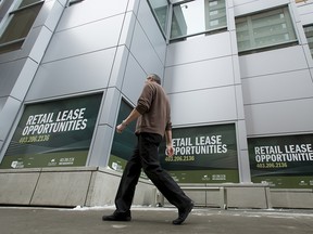 Lease-opportunity signs hang in a building in downtown Calgary.